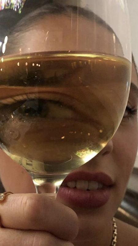 A playful close-up through a wine glass